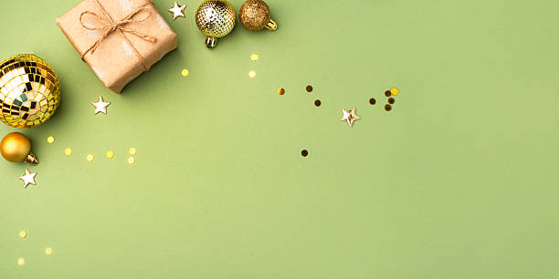 istock Christmas gift with ornaments on a green background 2243550580