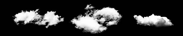istock Fluffy white clouds isolated on black background, showcasing different shapes and textures 2243560054