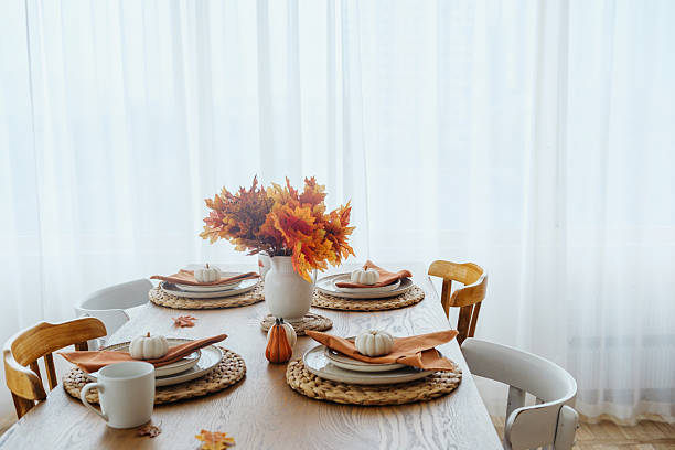 istock Autumn table setting with pumpkins and fall leaves, warm autumn decor 2243562240