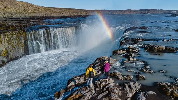istock Stunning rainbow reflecting over the powerful Selfoss waterfall in Iceland 2243565857