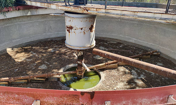 istock Rusty, empty sedimentation tank maintenance at defunct treatment plant. 2243570824
