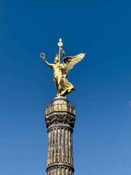 istock Berlin victory column statue of victoria against blue sky 2243577742