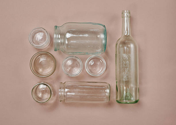 Close up of empty glass water bottles on a table