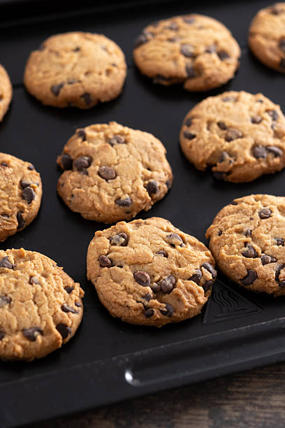istock Baked chocolate chip cookies on a black baking tray 2243589578