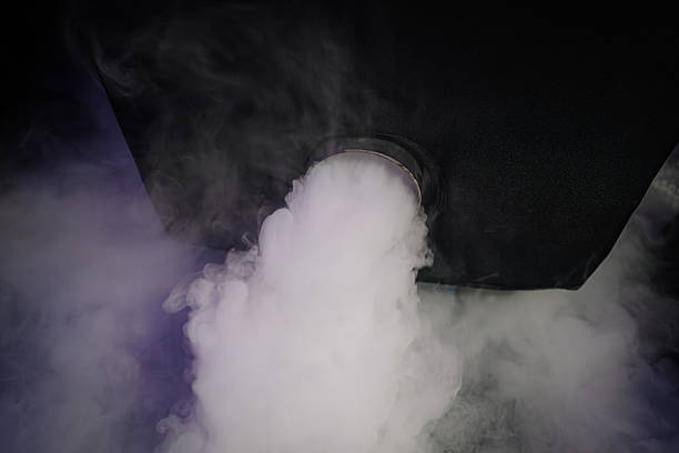 istock Smoke billowing from a device, creating an atmospheric effect with swirling mist, highlighting the dynamic interaction of light and vapor in a darkened environment 2243593590