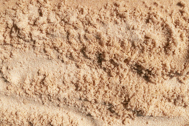istock Fine beach sand texture with natural patterns and warm beige tones 2243594970