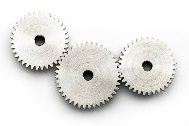 istock three interlocking gears against a white background as a close-up 2243596625