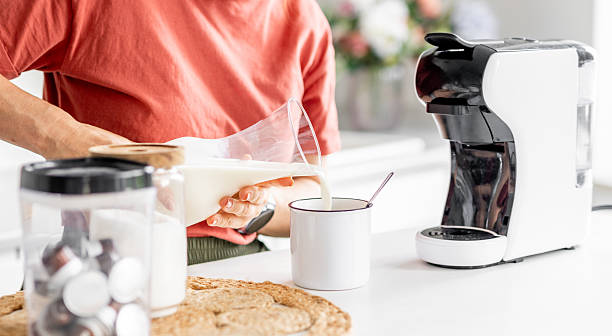 istock Woman Adding Milk To Coffee 2243599447