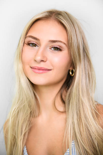 istock Pretty 18 years old blonde girl posing in studio 2243601369