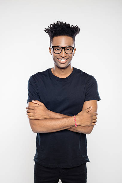 istock African man smiling with his arms crossed 2243602138