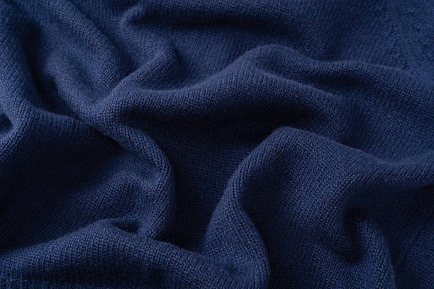 istock Navy blue merino wool sweater texture as background. Top view. 2243603392