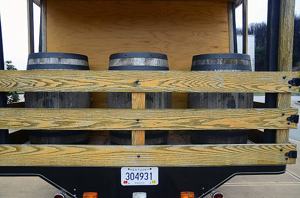 Delivery truck carrying large water bottles for commercial distribution. Concept of water supply, logistics, hydration, and distribution services.