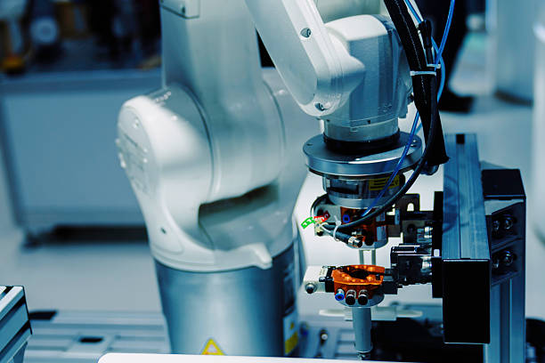 istock robot arm  working in factory 2243605377