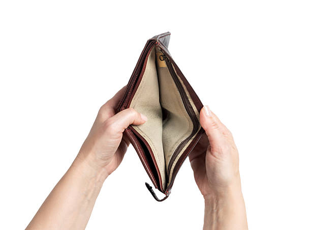 istock Female hands holding an open empty wallet isolated on white background. Concept of poverty, lack of money, financial crisis, and personal budget problems. File contains clipping path. 2243607316