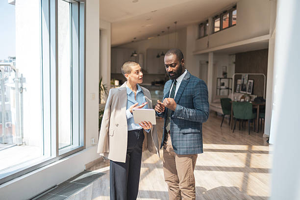 istock Professional business colleagues discussing work in a bright modern office setting 2243607526