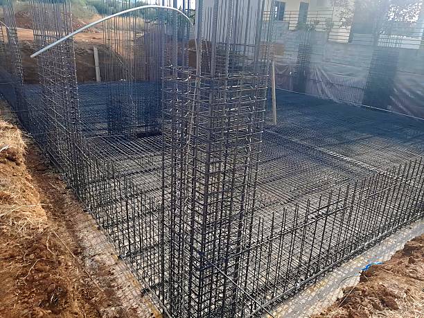 istock Reinforced concrete foundation construction with steel rebar grid 2243609199