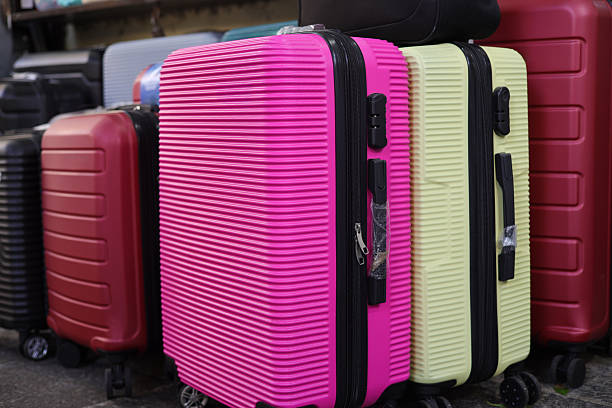 istock Suitcases for sale at a market stall. 2243609945