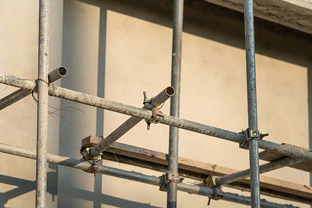 istock Connection joint of working platform scaffold at the house building site. 2243610855