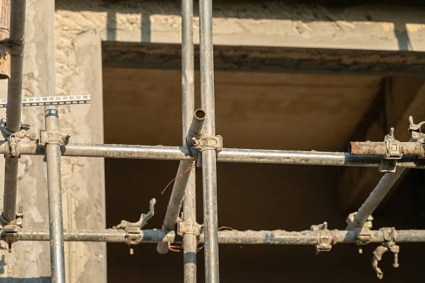 istock Connection joint of working platform scaffold at the house building site. 2243610856
