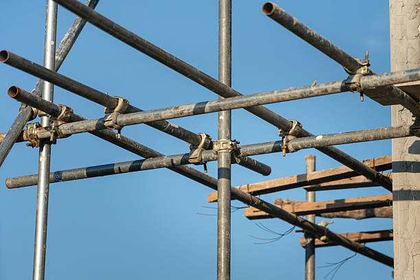 istock Connection joint of working platform scaffold at the house building site. 2243610885