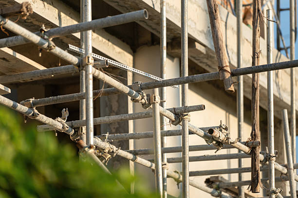 istock Connection joint of working platform scaffold at the house building site. 2243611451