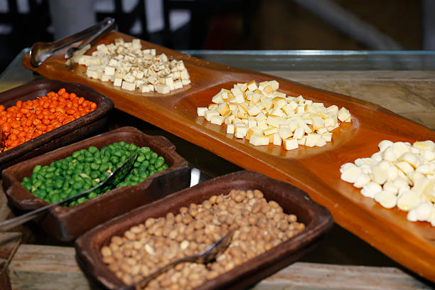 istock Charcuterie board with cheese cubes nuts and fresh vegetables 2243615745