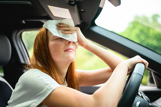 istock Beautiful young girl driver with with her white car warm state 2243619004