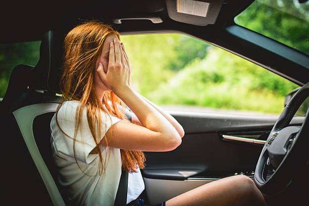 istock Beautiful young girl driver with with her white car 2243619107