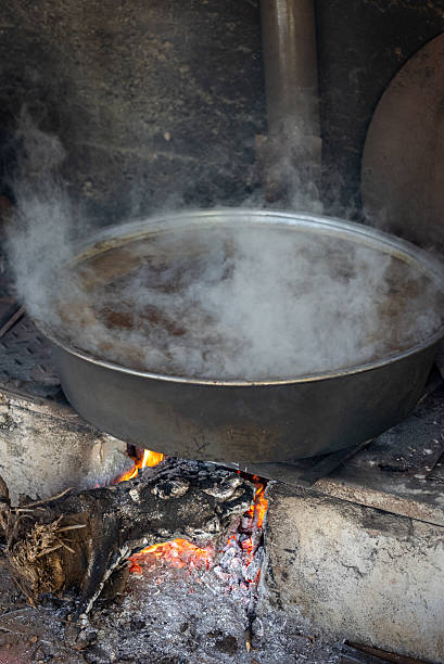 istock Grape molasses is boiled in old-fashioned cooking pots 2243619122
