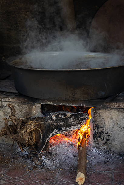 traditional hungarian goulash is boiling in a cauldron.
