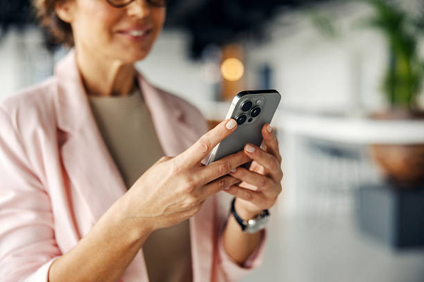 Businesswoman using smartphone connecting with modern technology
