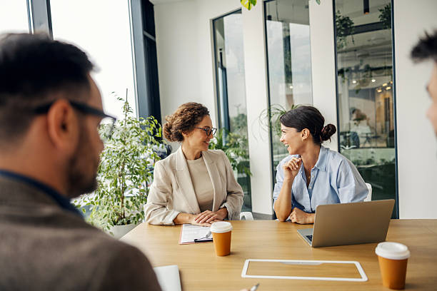 istock Businesswomen discussing during a meeting in modern office 2243620074