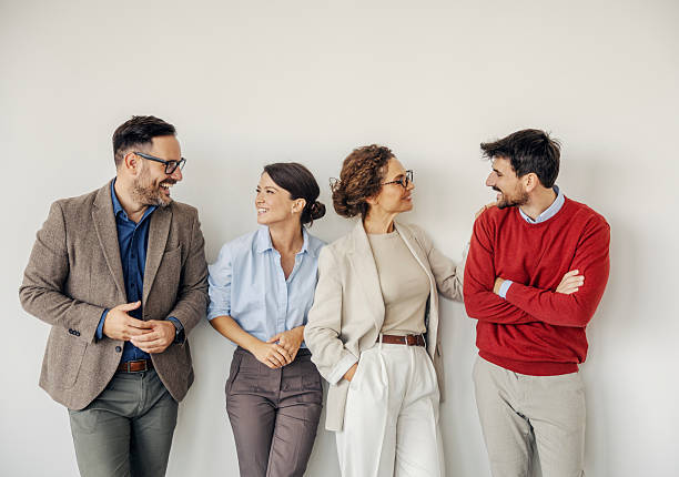 istock Business colleagues having a happy conversation in office 2243620212