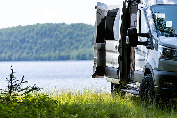 Van Life, Camper van Parked Close to a lake During Summer, The Laurentian Mountains, Quebec, Canada.