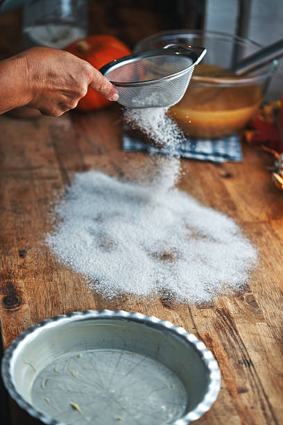 Preparing Pumpkin Pie for the Holidays in Domestic Kitchen