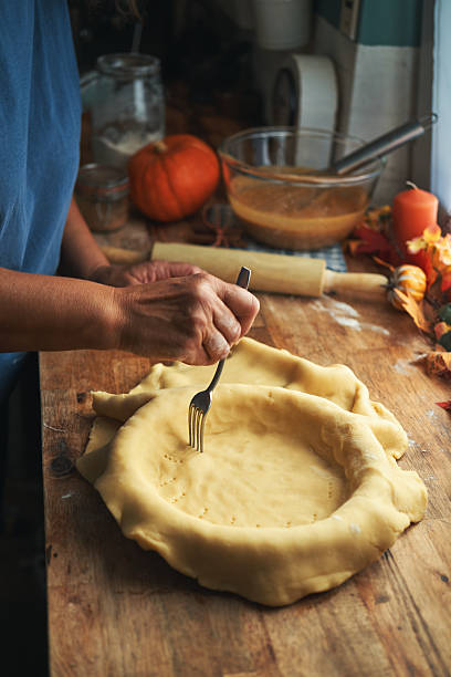 istock Preparing Pumpkin Pie for the Holidays in Domestic Kitchen 2243625494