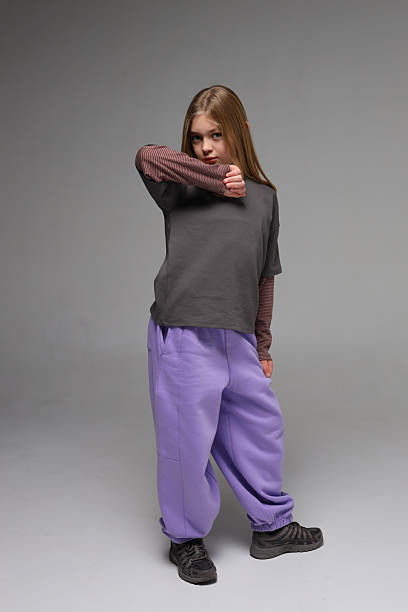 istock Young caucasian female in casual outfit posing confidently in studio 2243627230