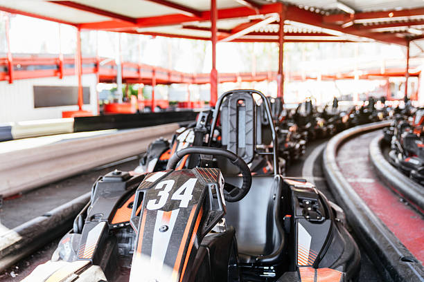 Go carts are sitting idle at this go cart race track
