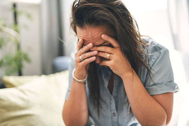 istock young woman with feeling sad and stressed, sick and headache 2243628137