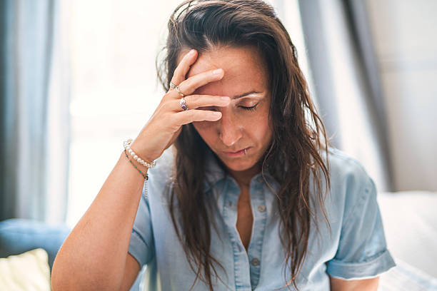 istock young woman with feeling sad and stressed, sick and headache 2243628142