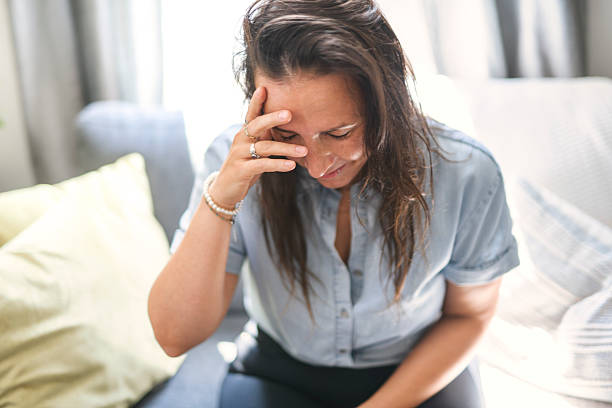 istock young woman with feeling sad and stressed, sick and headache 2243628143