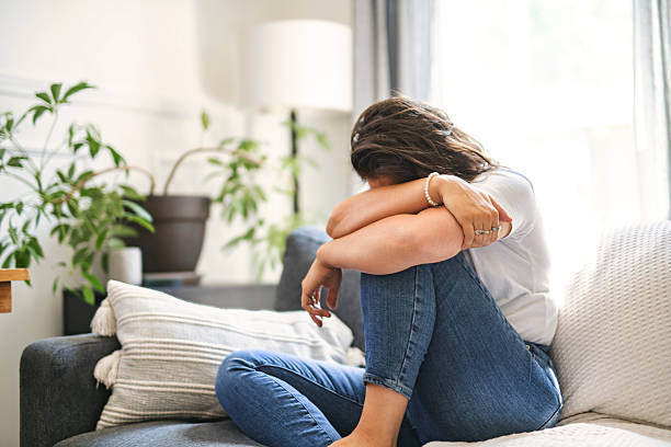 istock young woman with feeling sad and stressed, sick and headache 2243628191