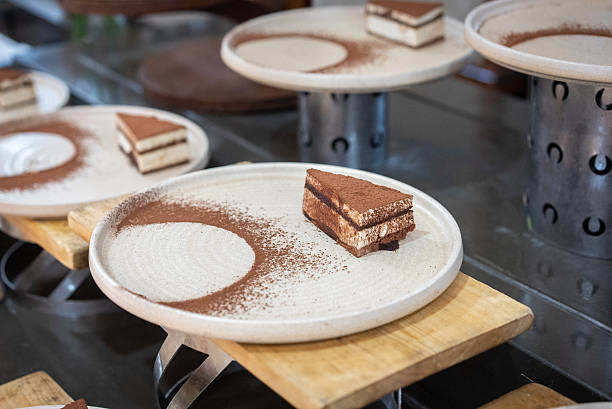 A group of Tiramisu Nun closing on a white plate.