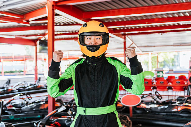 istock Young man celebrating victory at karting circuit 2243631961