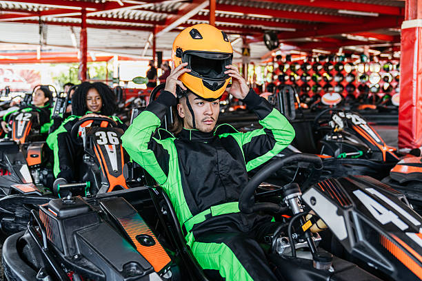 Child driving go-cart on racing track