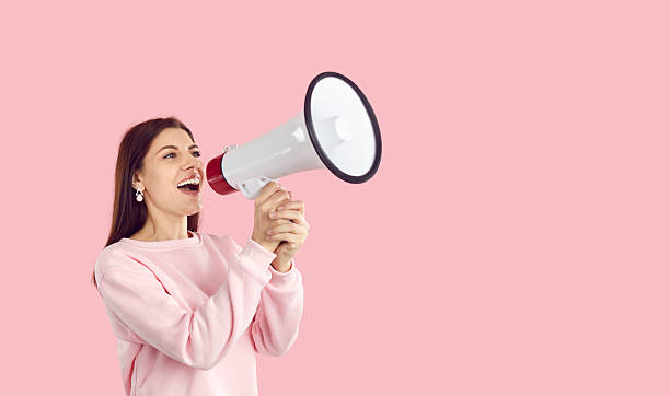 istock Woman make announcement in loudspeaker 2243636101
