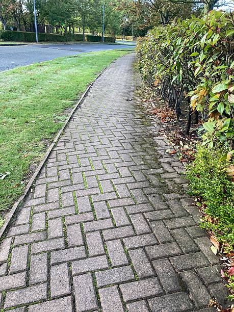 istock A footpath with a grass area on the left and a hedge on the right with partial sight of a road - Chester Cheshire 2243637083