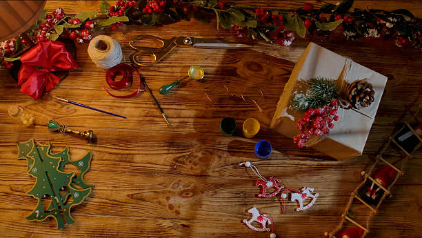 istock Christmas gift wrapping and craft tools on a wooden table 2243640600