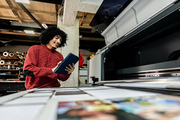 istock Professional operating digital printing equipment in print shop 2243642161