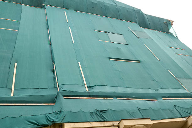 istock Building Covered with Green Tarp 2243643860